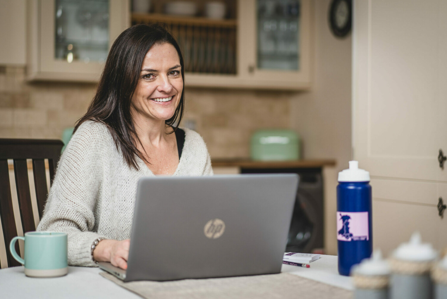 Woman sat in front of laptop