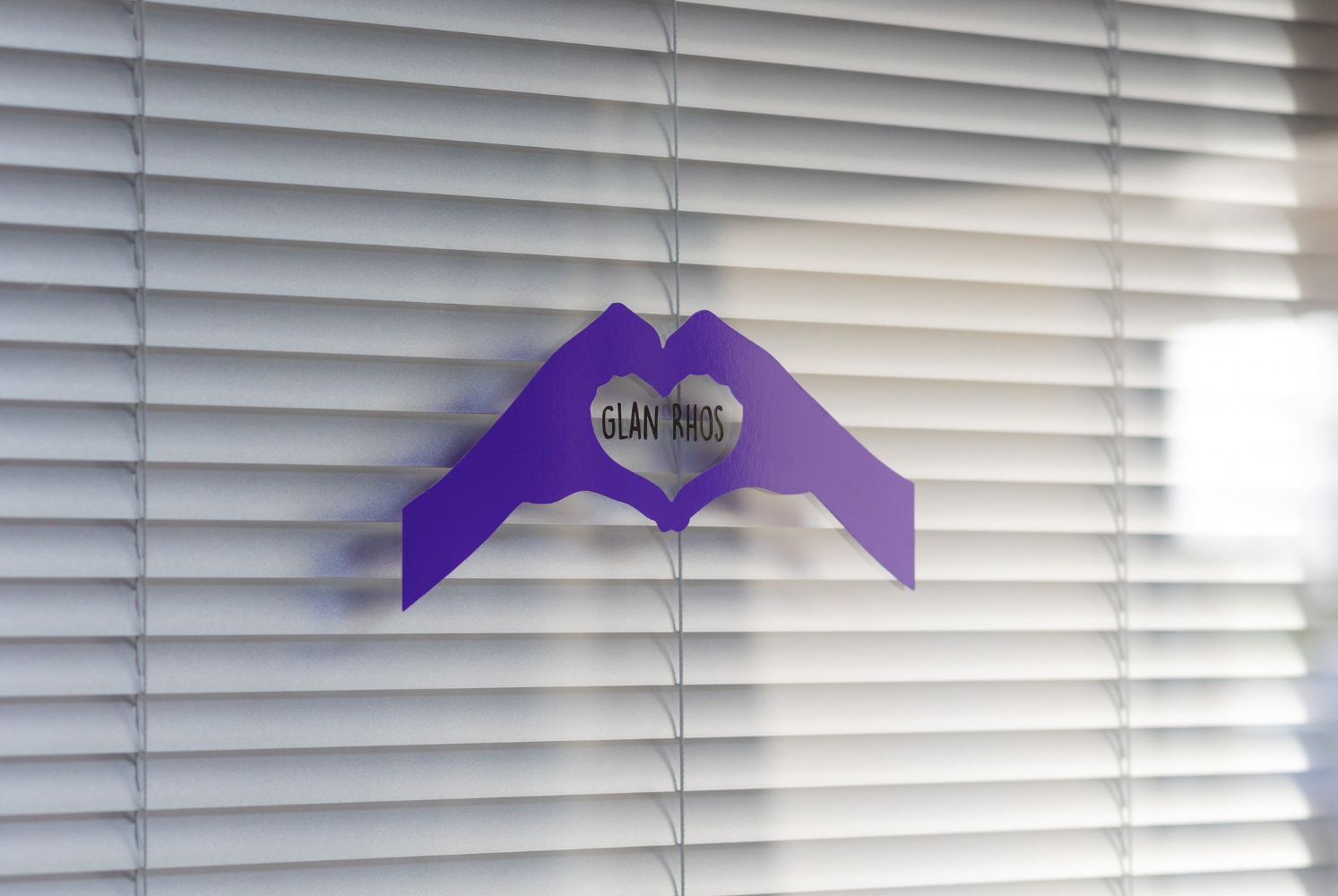 Glan Rhos heart logo in purple