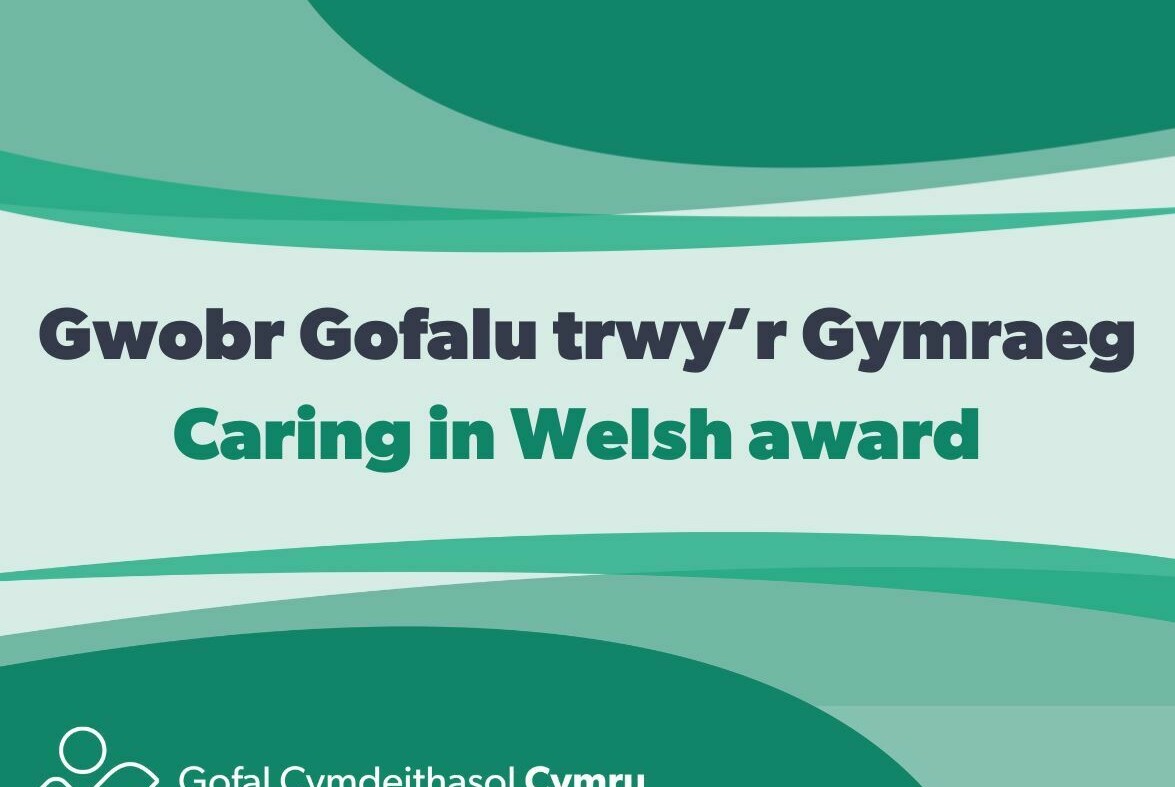 Text that says Gwobr Gofalu trwy'r Gymraeg/Caring in Welsh aware with Social Care Wales logo attached